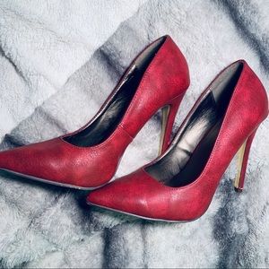 Red pointed toe heels